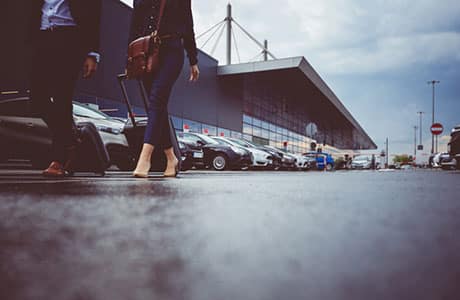 View of People Walking Toward Detroit Metro Airport Parking Lot