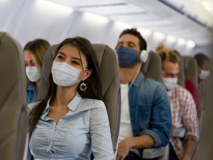 Woman with Mask on Airplane