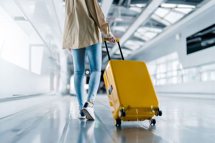 Woman with Luggage in Airport