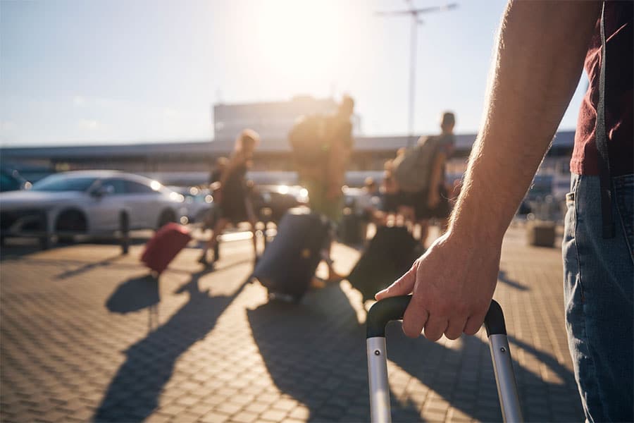 Closeup of People Pulling Luggage