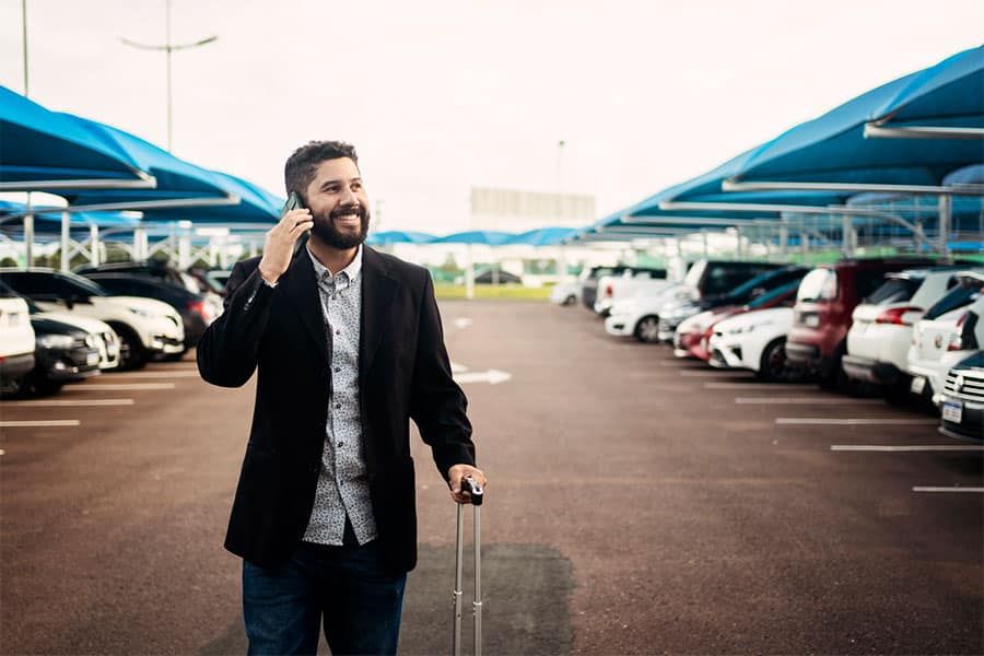 Man Walking in Parking Lot